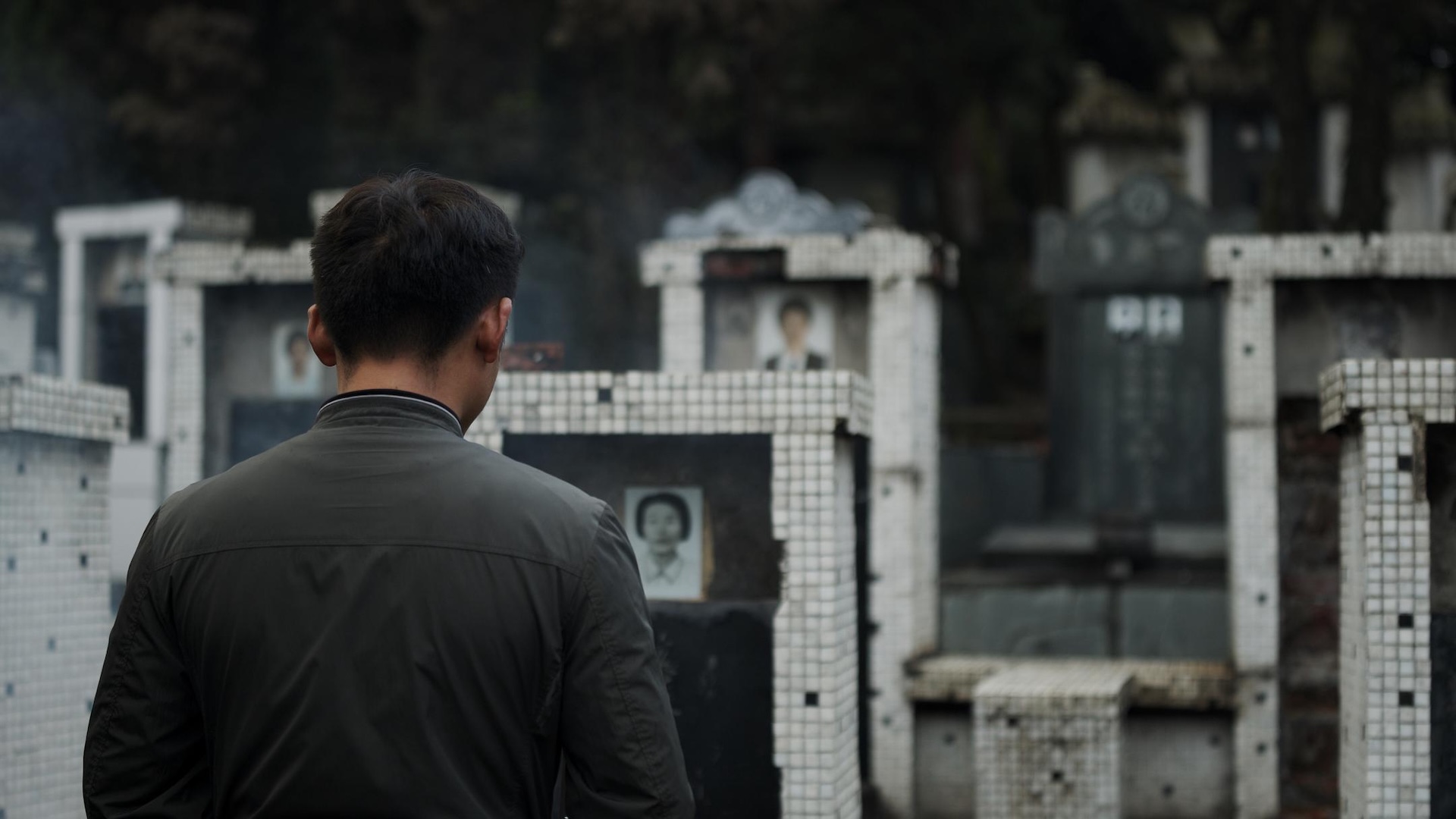 A man facing a row of graves, from Some Manifestations of the South